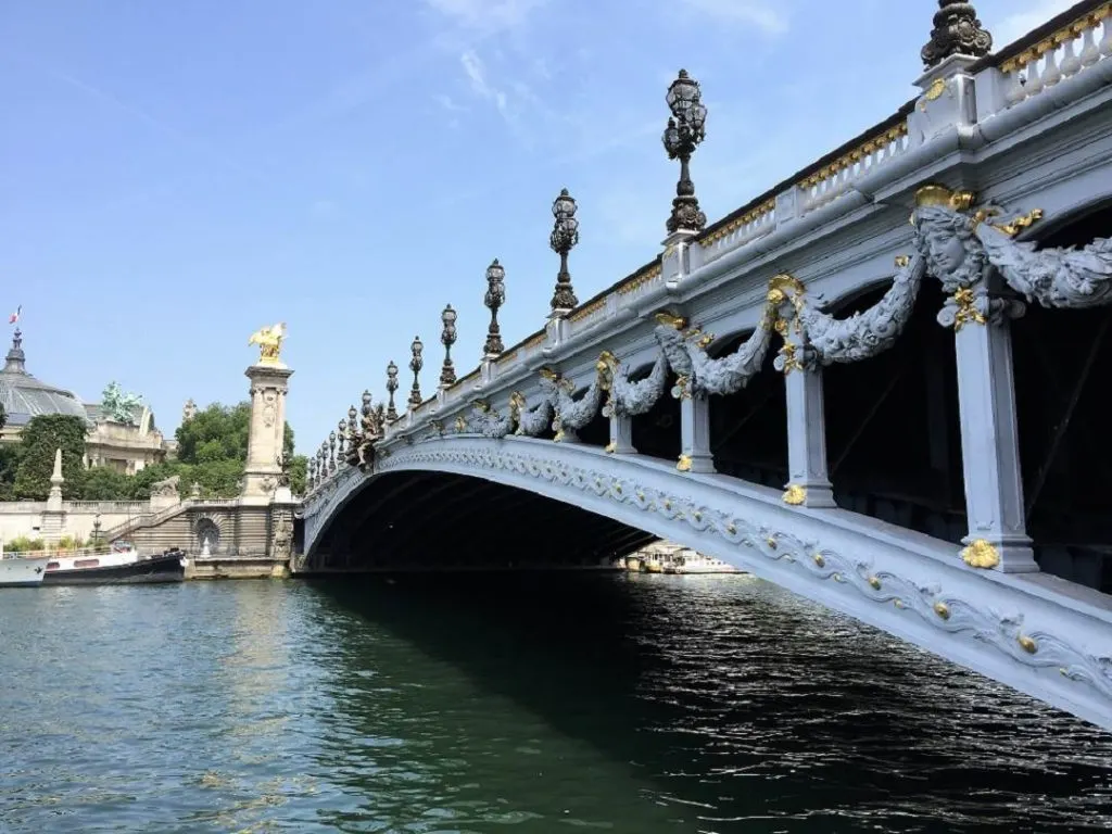 bridge over a river in Paris while on a river cruise