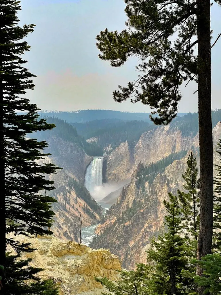 a waterfall coming down through the Grand Canyon of Yellowstone at Artist Point