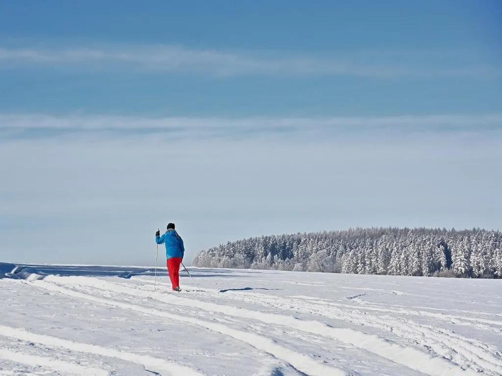 person cross country skiing in the snow
