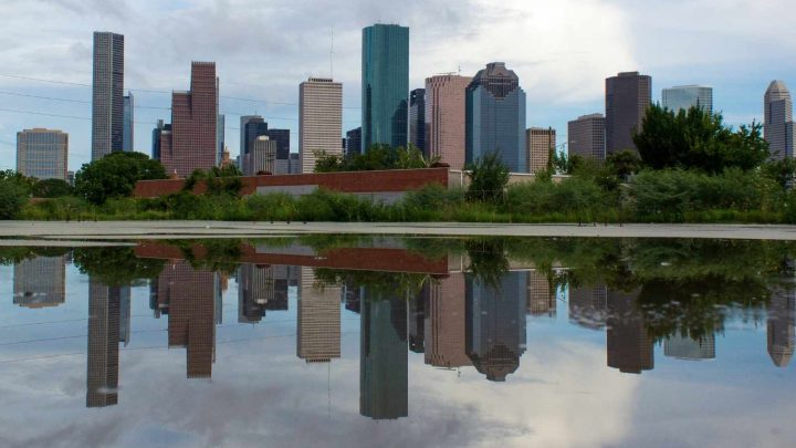 lake with the Houston skyline reflecting in it