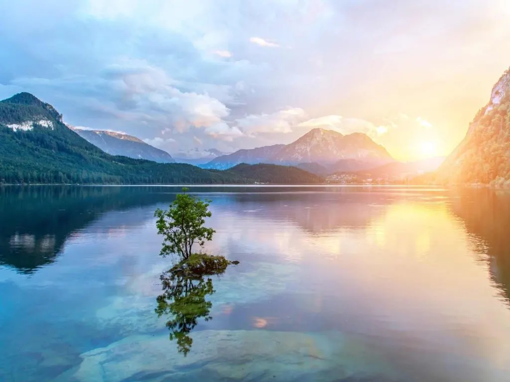Sunrise reflecting in the lake with mountains
