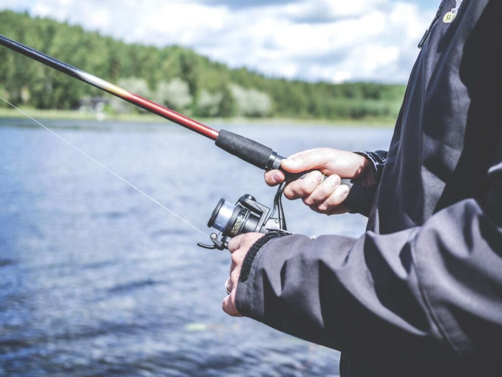 person fishing on lake