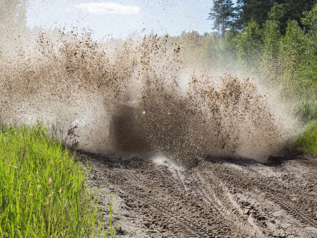 ATV vehicle going through mud