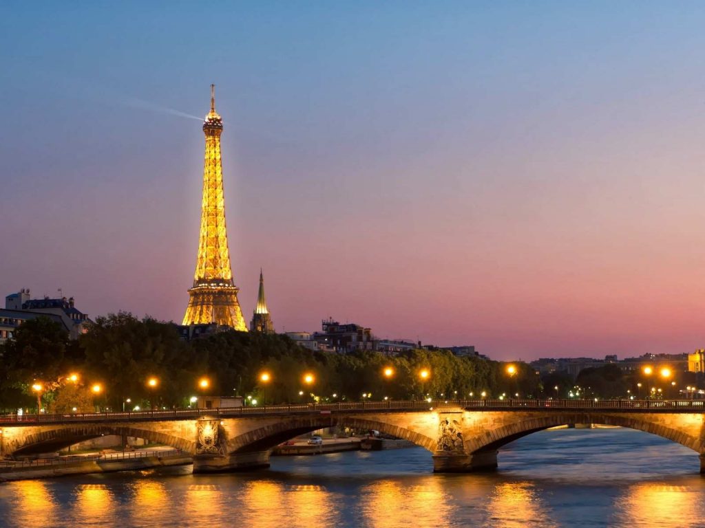 eiffel tower and Seine river at night