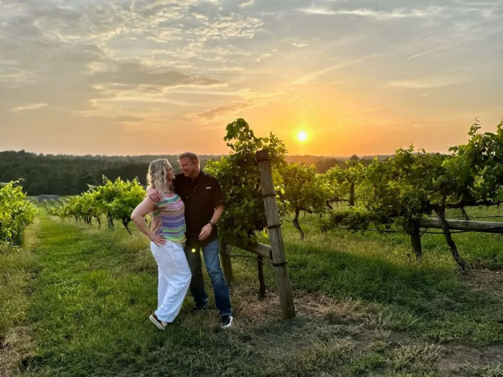 Marty and Michelle in Enoch's Stomp Vineyard at sunset