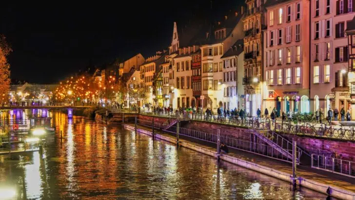 Strasbourg canal and building lit up at night