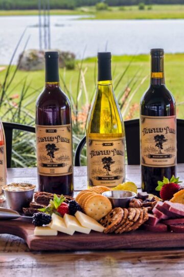 Bottles of twisted Pines wine behind a charcuterie board